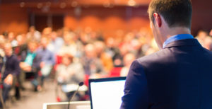 Public-speaker-at-Business-Conference.-525984975_3898x2000